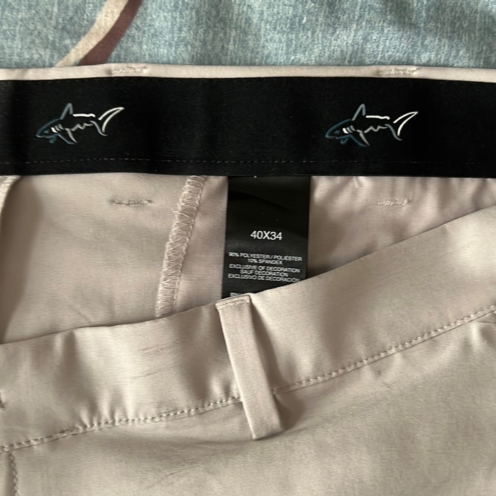 Greg Norman, tan, men’s golf pants, new without tags